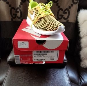 Brand new neon orange black and green Nike Roshe